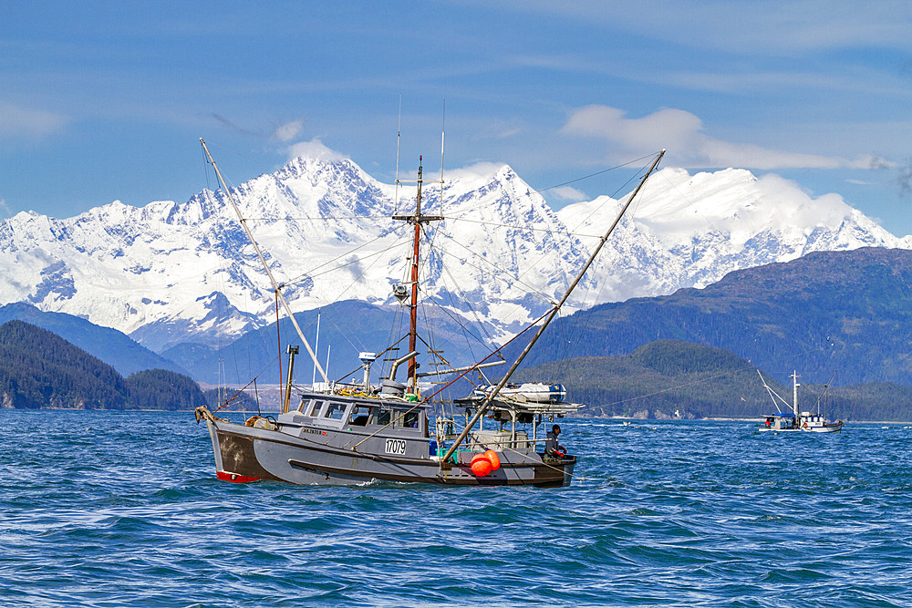 Long line fishing boat in Cross Sound with the Fairweather Mountain Range as backdrop, Southeast Alaska, United States of America, North America