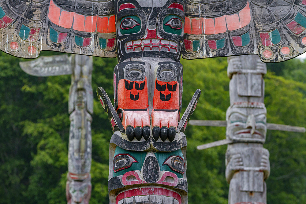 Totem poles in the cemetery of the First Nations Kwakwaka'wakw people in Alert Bay, British Columbia, Canada, North America