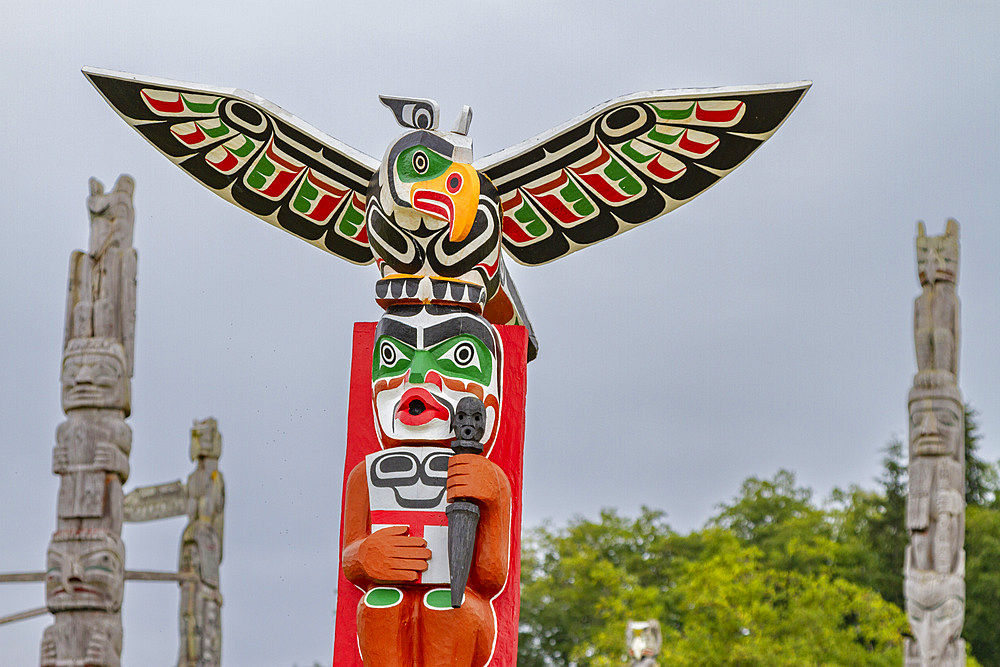 Totem poles in the cemetery of the First Nations Kwakwaka'wakw people in Alert Bay, British Columbia, Canada.