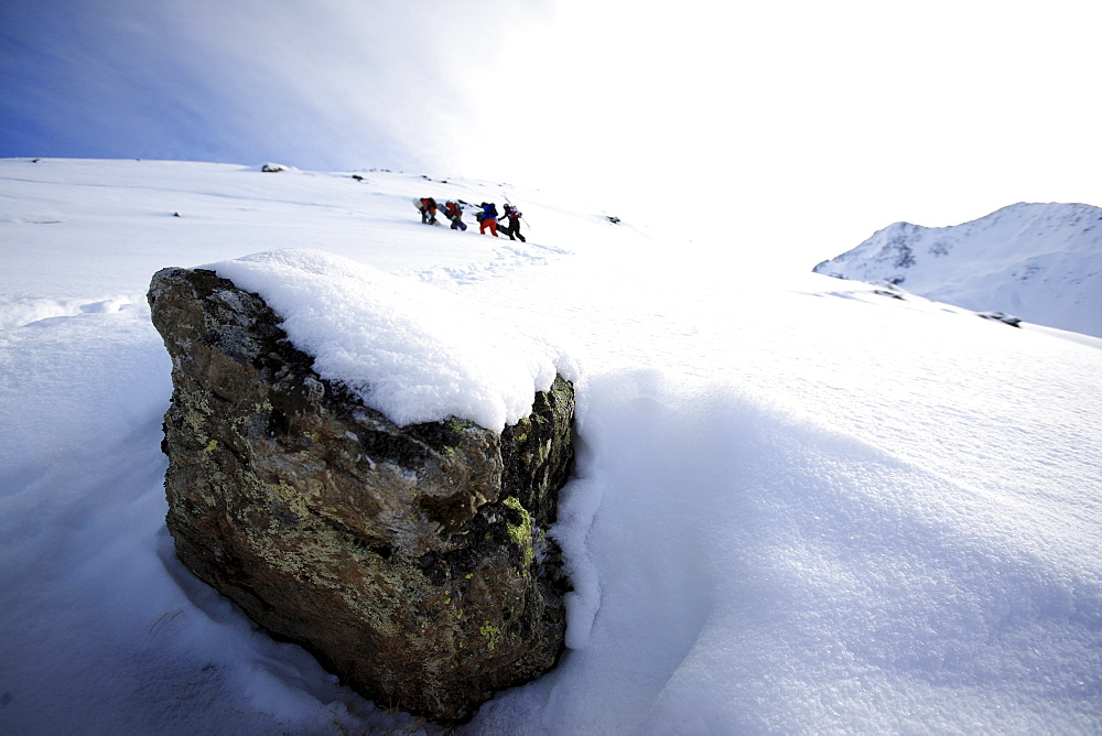 A group of people walking through the snow, Ski Region Paznaun, Tyrol, Austria