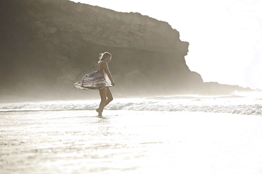 Young woman at beach, Fuerteventura, Spain