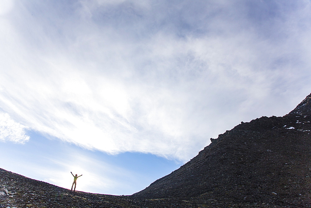 Man on the ridge of mount Kreuzspitze, Johannis Hut, Virgen Valley, Tyrol, Austria