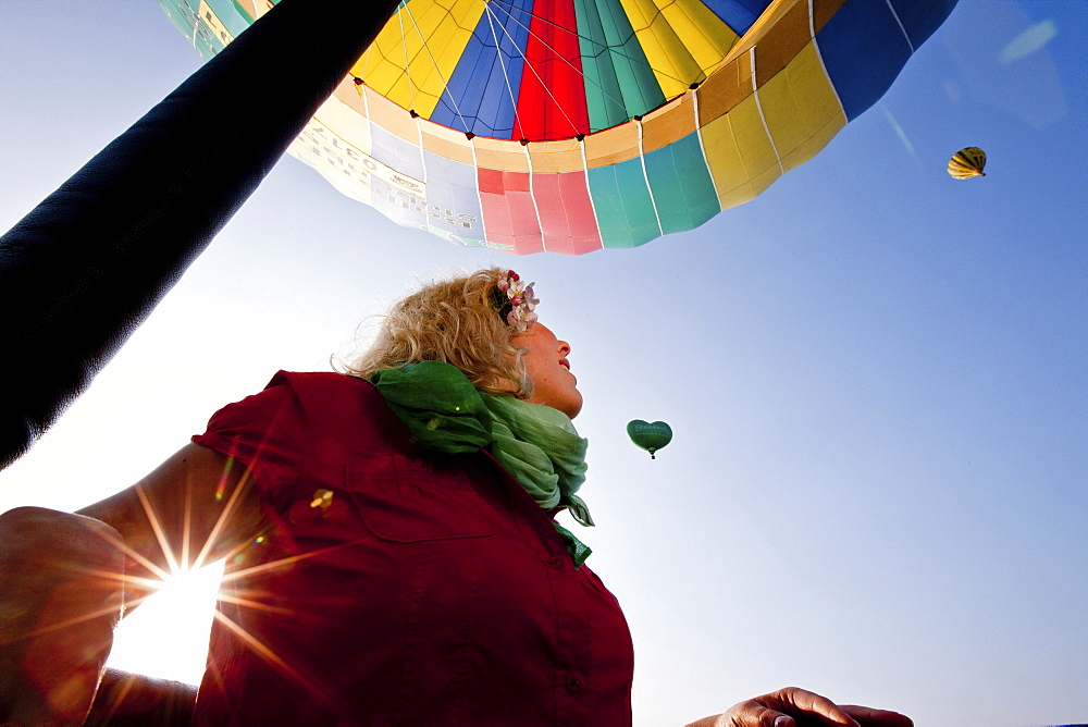 Young woman in a hot-air balloon, Styria, Austria