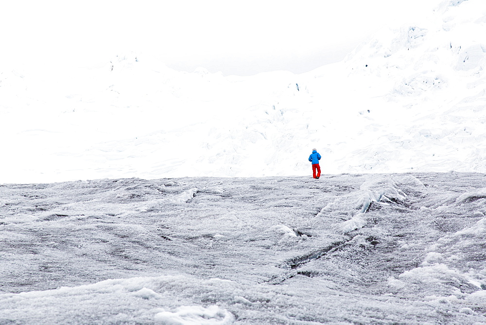 Man walking over a glacier, Artesonraju, Paron Valley, Caraz, Huaraz, Ancash, Cordillera Blanca, Peru