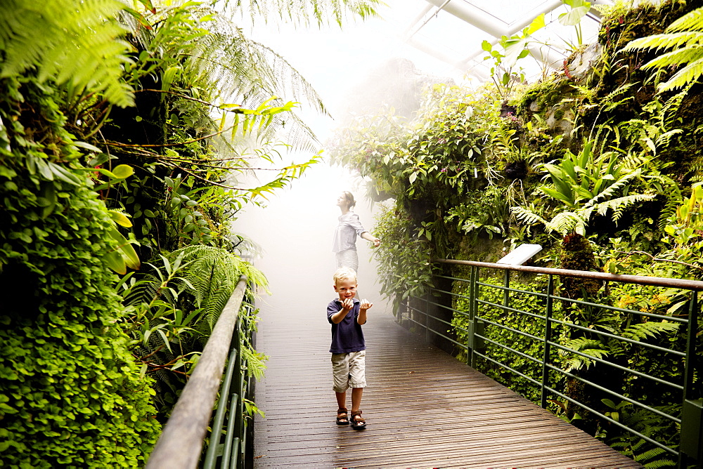 Mother and son inside a tropical greenhouse, Botanic Gardens, Singapore