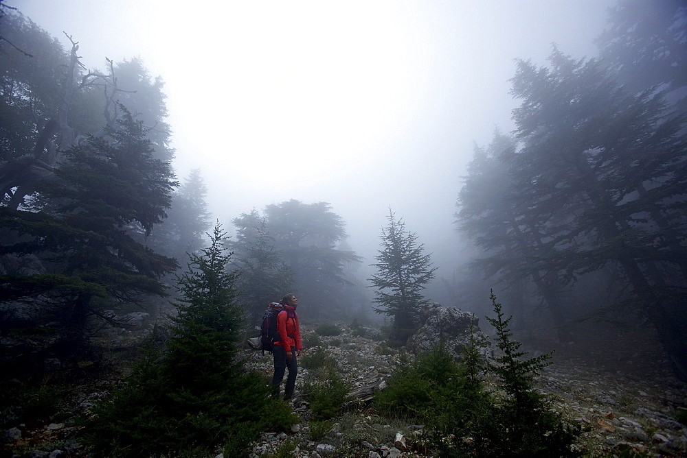 Woman hiking along long-distance footpath Lycian Way, Antalya, Turkey