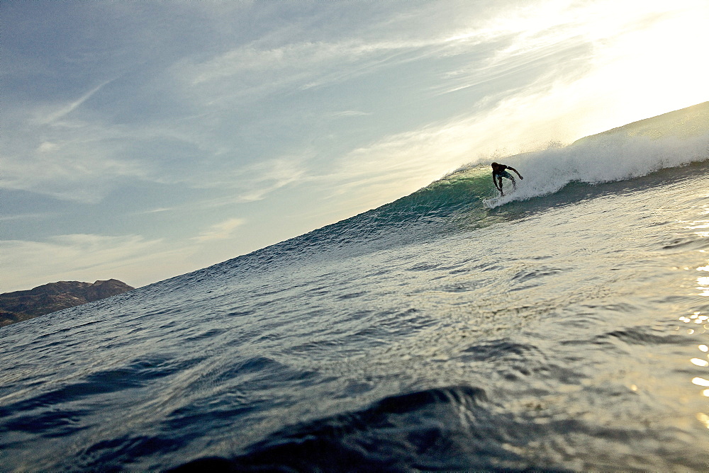 Surfer riding a wave, Praia, Santiago, Cape Verde