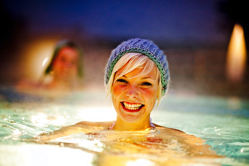 Young woman wearing a knit cap in thermal bath, Bad Radkersburg, Styria, Austria