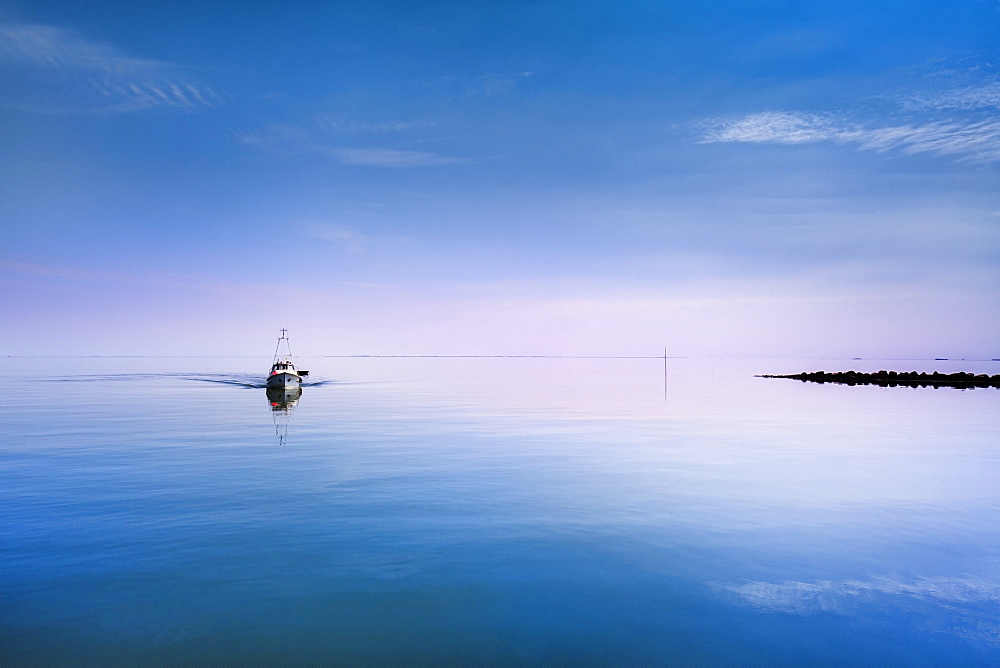 Boat in calm water, Hallig Langeness, North Frisian Islands, Schleswig-Holstein, Germany