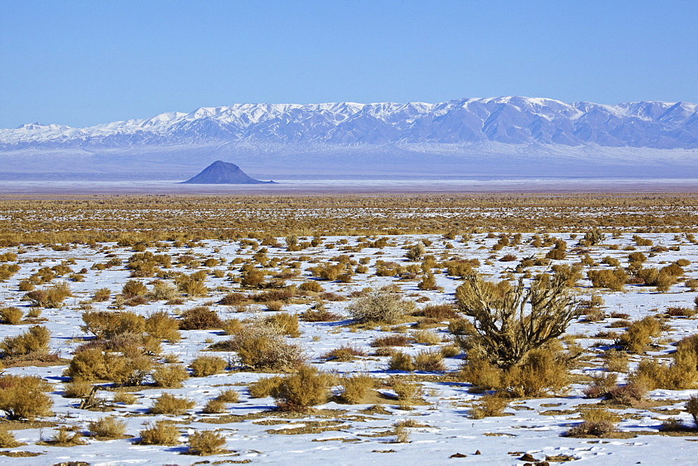 Volcanic cone in front of the Tarbagatai Mountains, Mongolia
