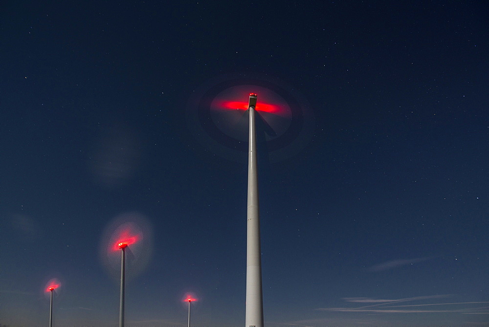 Wind turbines in the night sky, Rhade, Nordrhein-Westfalen, Germany