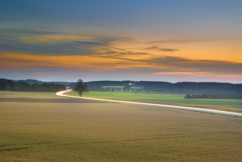 Evening sky in Puchheim overlooking the main road B2 towards Fuerstenfeldbruck, Puchheim, Bavaria, Germany