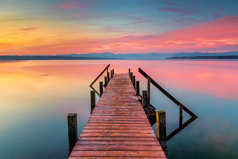 Jetty at sunrise on Lake Starnberg, Bavaria, Germany