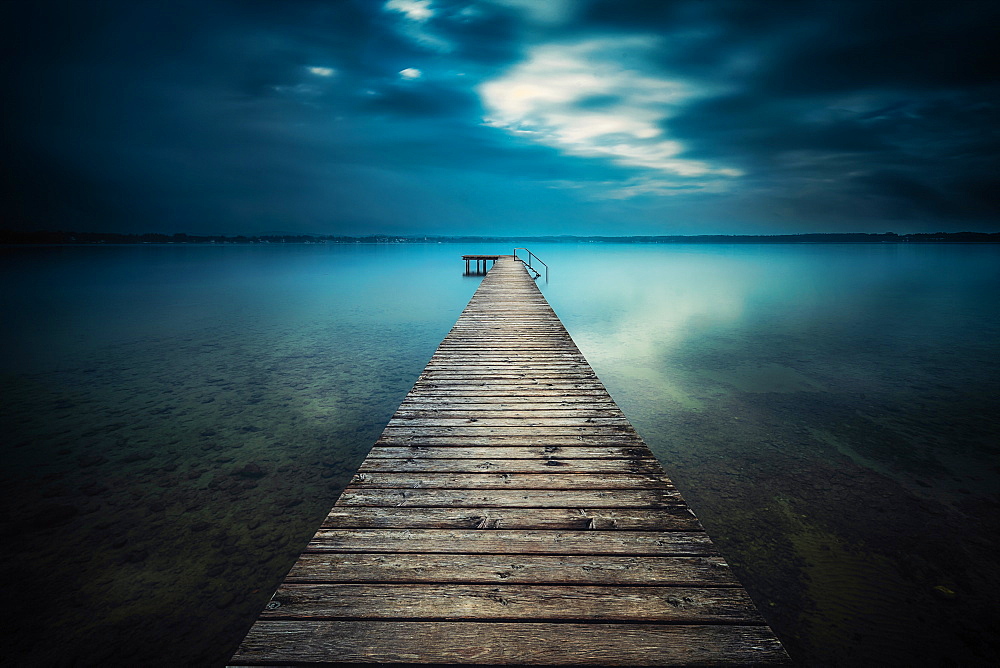 Sunset in bad weather at Lake Starnberg, Bavaria, Germany