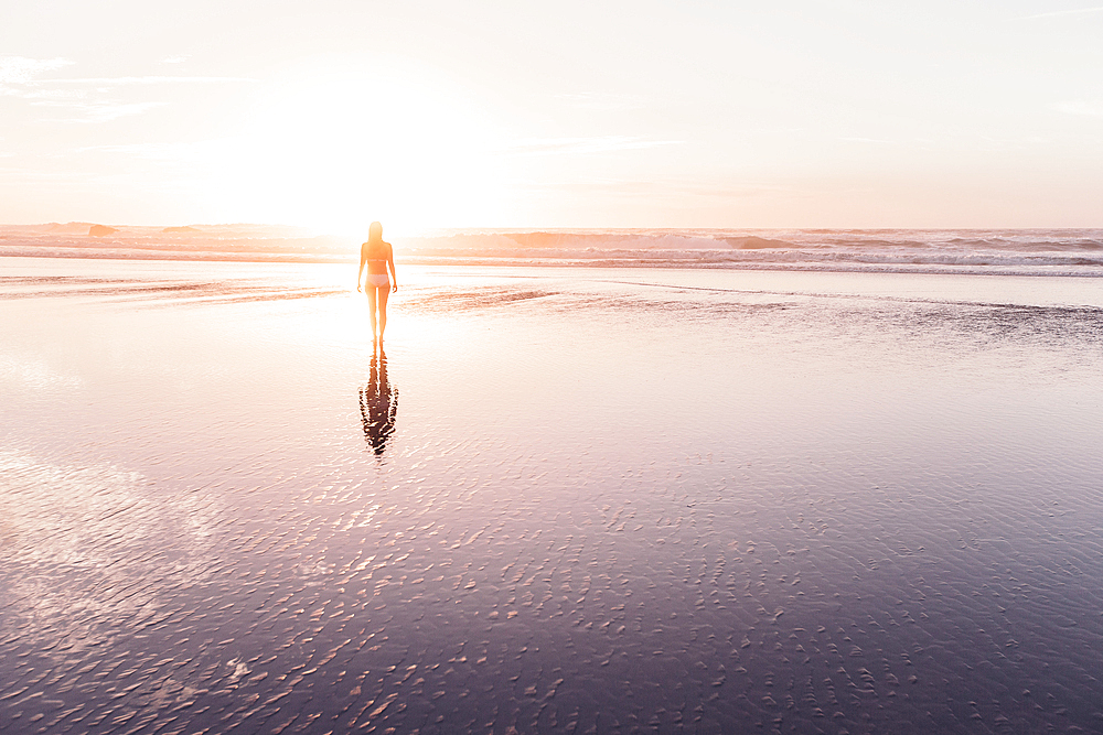 Woman walks on the beach in sunset, Portugal, beach, vacation