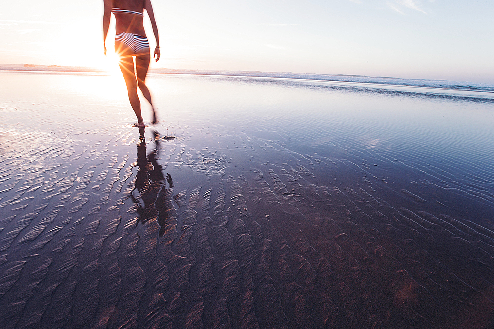 Woman walks on the beach in sunset, Portugal, beach, vacation