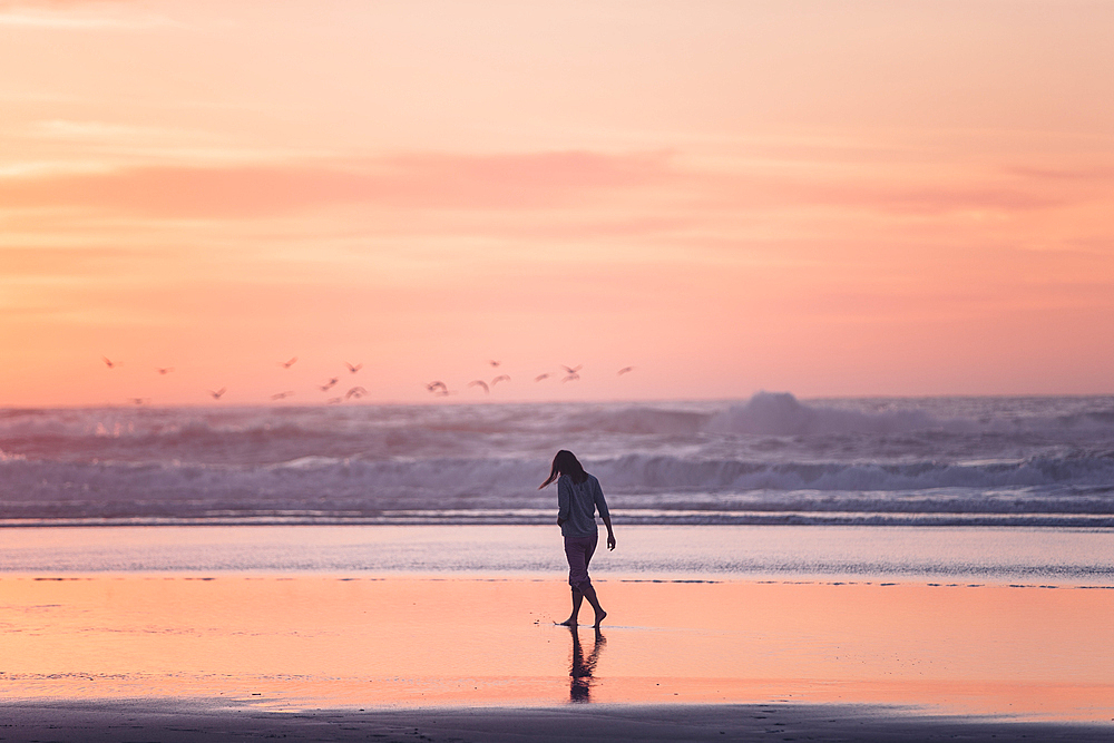 Woman walks on the beach in sunset, Portugal, beach, vacation