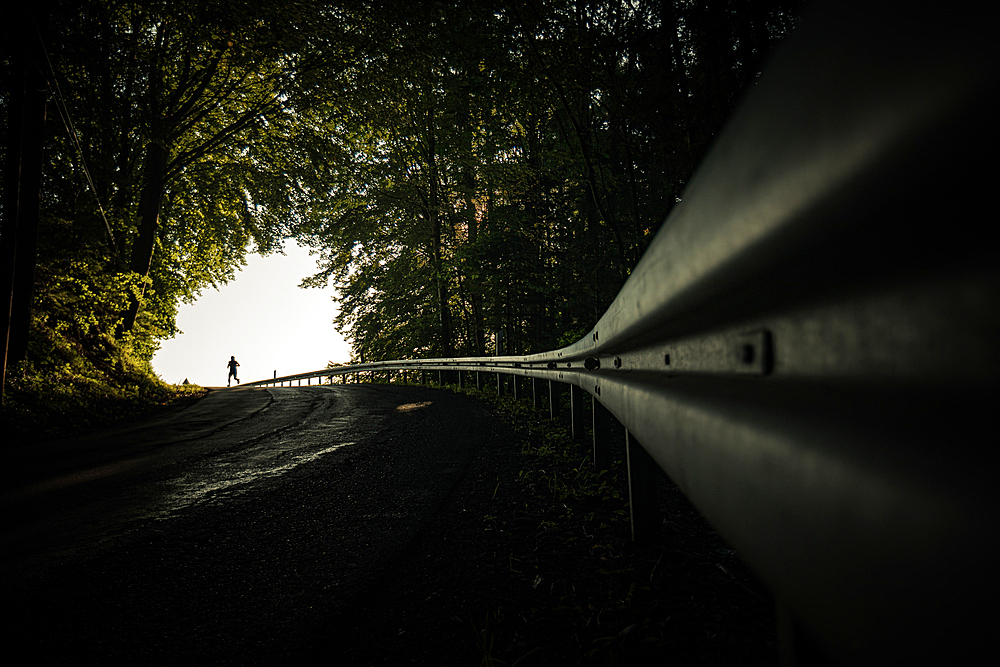 Runners on an empty street in the morning hours, running, sports, allgäu