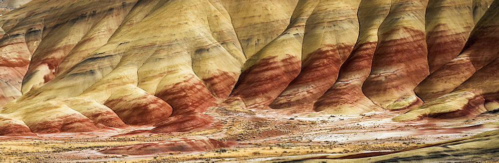 The claystone hills are graceful and colourful at John Day Fossil Beds National Monument, Mitchell, Oregon, United States of America