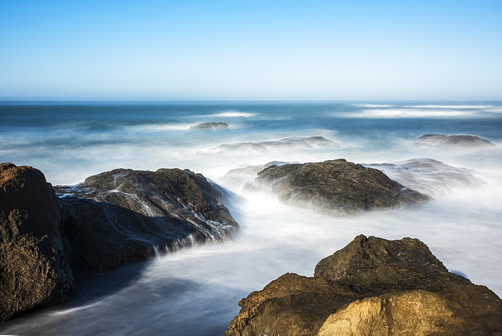 Waves softened by a long exposure surge onto the beach at MacKerricher State Park and Marine Conservation Area near Cleone in Northern California, Cleone, California, United States of America