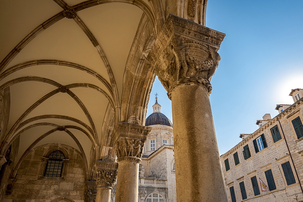 Detail of columns in the Rector's Palace facade and the Cathedral in the background, Dubrovnik, Dubrovnik-Neretva County, Croatia