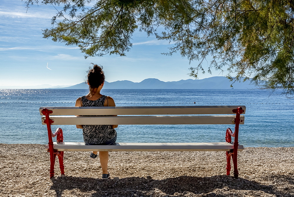 Woman enjoying the view of the Makarska Riviera, Dalmatia, Croatia