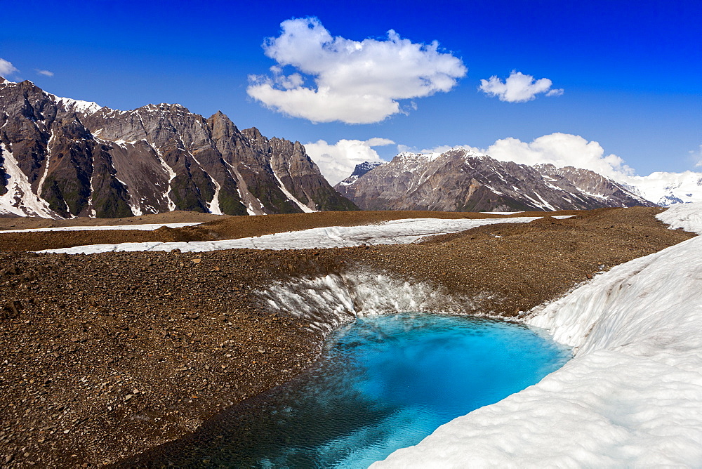 Glacial lake on Kennicott Glacier, with Wrangell Mountains in background, in summer, Wrangell–St. Elias National Park and Preserve, Alaska, United States of America