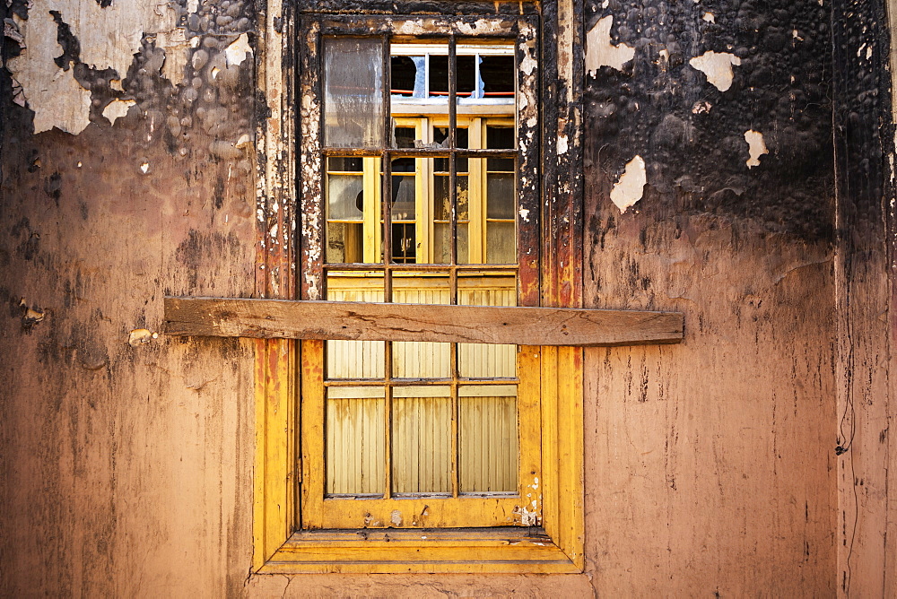 Window in a burned-out building in Barrio Yungay, Santiago, Region Metropolitana, Chile