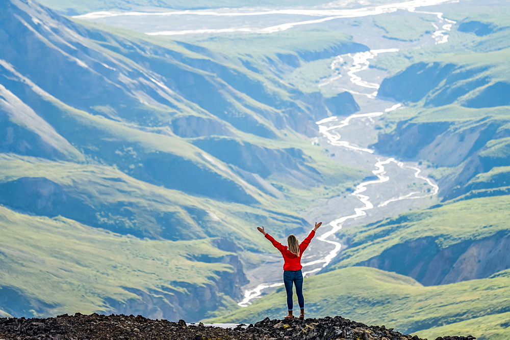 Woman exploring the rugged mountains of Kluane National Park and Reserve, Haines Junction, Yukon, Canada