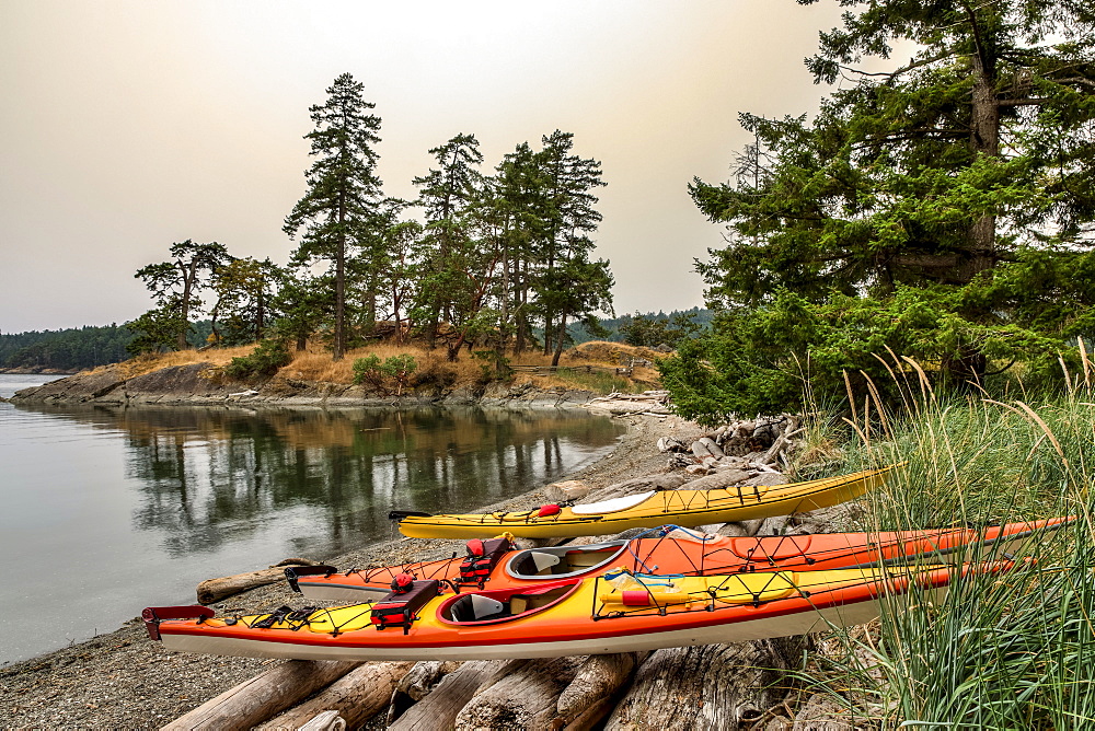 Kayaks on a small Islet at Beaumont Marine Park in Bedwell Harbour, South Pender Island, Pender Island, British Columbia, Canada.