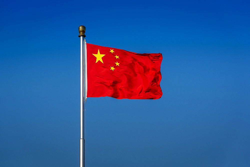 The flag of China, also known as the Five-star Red Flag, in Tiananmen Square, Beijing, China