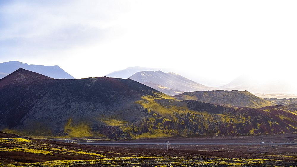 Small volcanos like these ones dot Iceland and the green moss that grows on the rich volcanic soil is iconic to Iceland, Grundarfjorour, Iceland