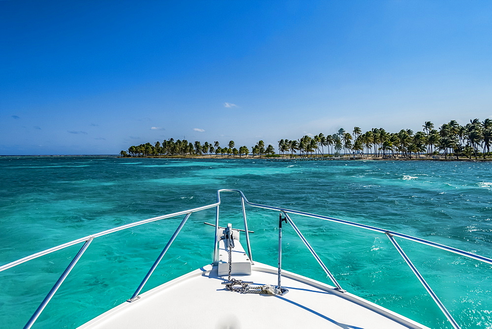 Vibrant turquoise ocean and the bow of a boat, Belize