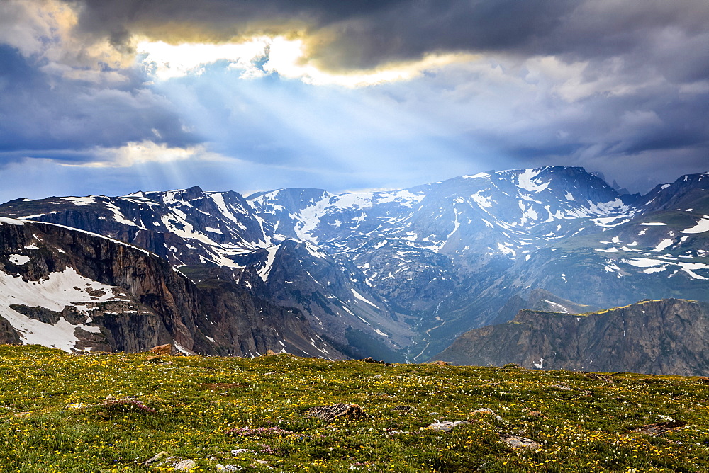 View from the Beartooth Highway of the Beartooth Mountains and the sun rays breaking through the clouds, Cody, Wyoming, United States of America