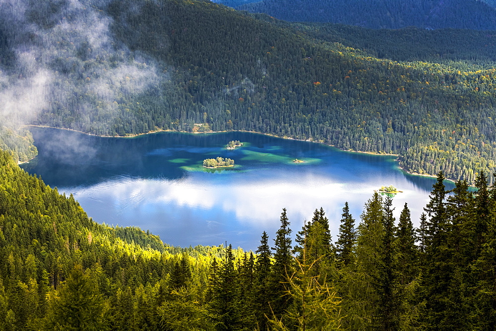 Alpine lake viewed from above and framed with tree covered mountain slopes, Grainau, Bavaria, Germany