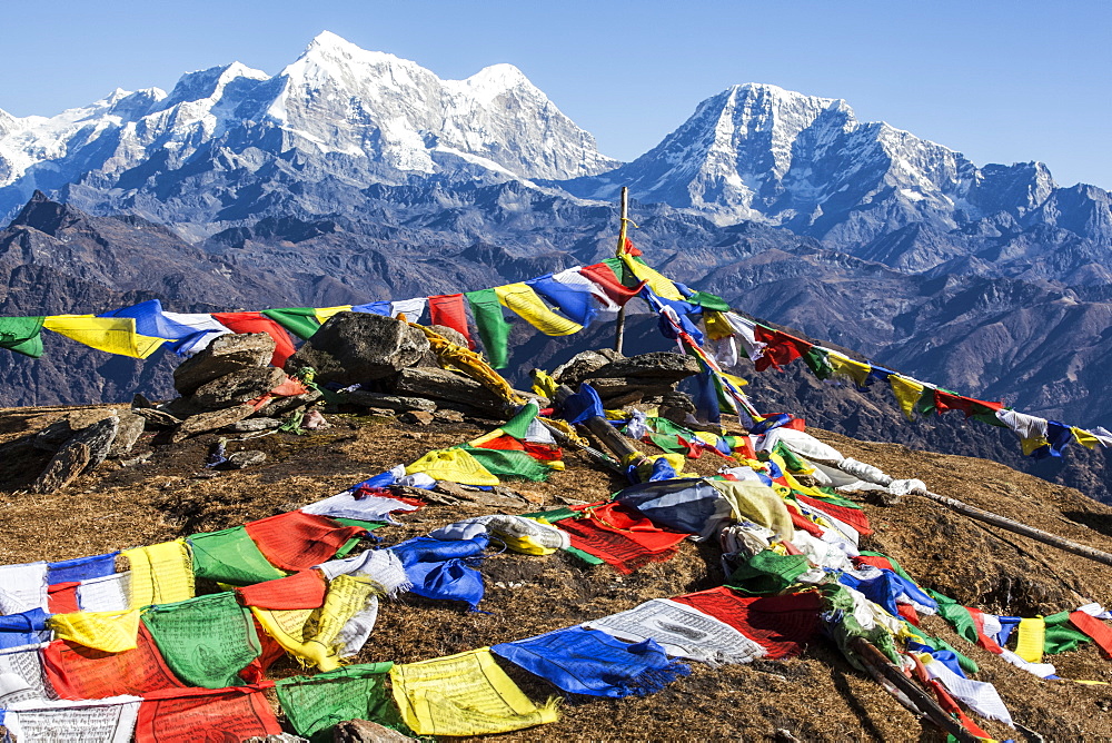 Buddhist prayer flags at the summit of Pikey Peak in the Himalayas, Nepal