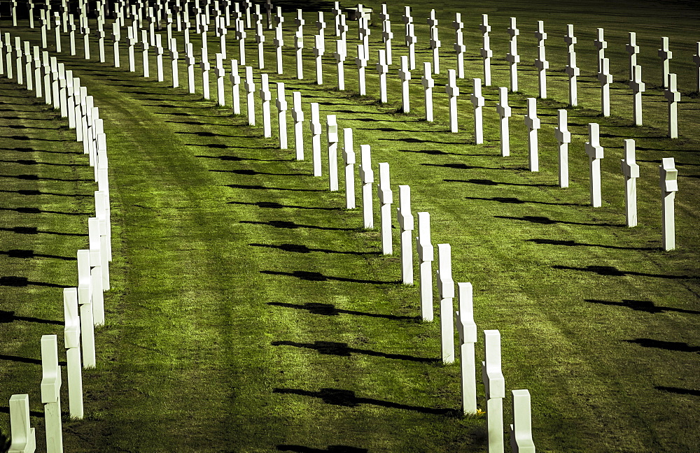 Rows of white crosses on grass, Cambridge American Cemetery and Memorial, Cambridge, Cambridgeshire, England