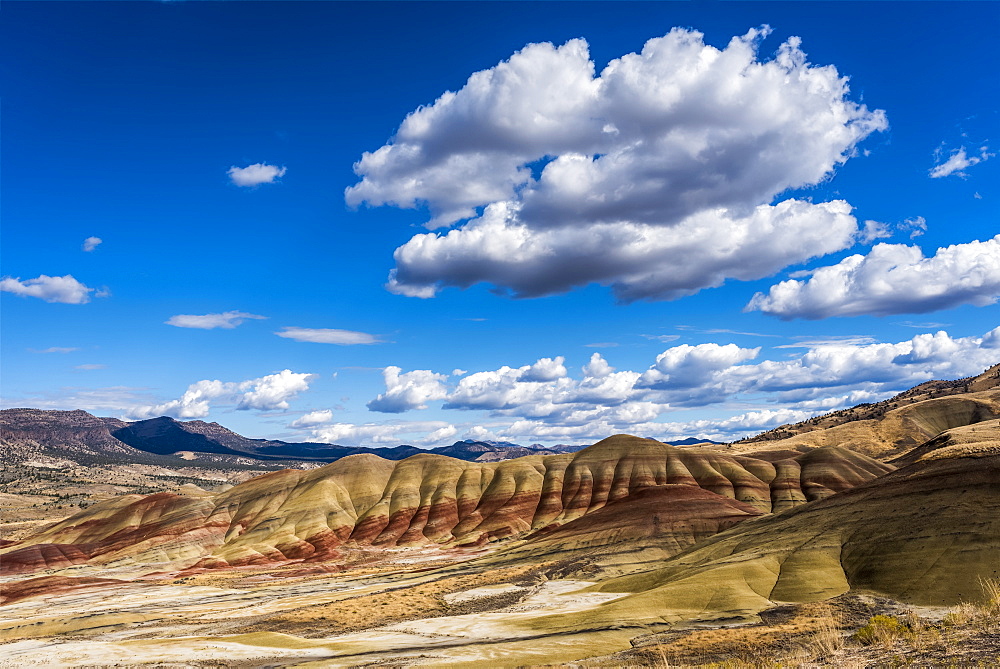 Clouds float above the Painted Hills Unit of John Day Fossil Beds National Monument, Mitchell, Oregon, United States of America