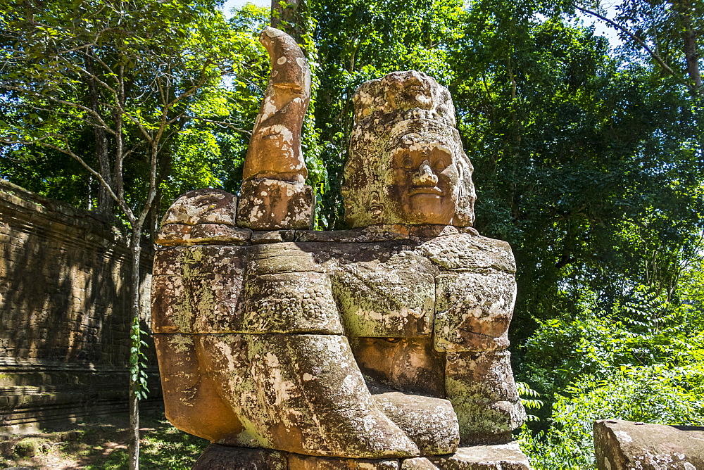 Stone figures on the causeway to the Victory Gate tower (Gopuram), Angkor Thom, Siem Reap, Cambodia