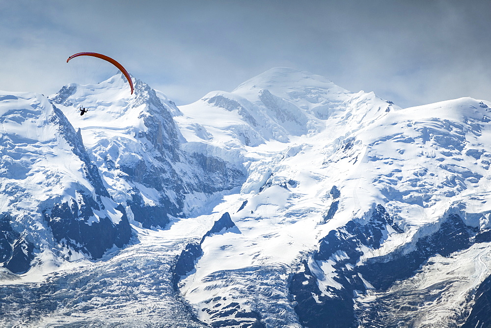 A paraglider flying over Mount Blanc in summer, Alps, Chamonix-Mont-Blanc, Haute-Savoie, France