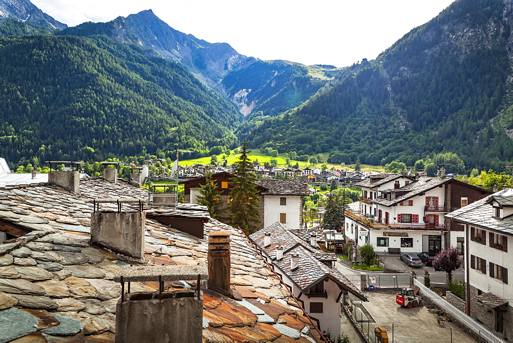 Historic stone roofs of buildings, viewed from city center of Courmayeur, Courmayeur, Aosta Valley, Italy