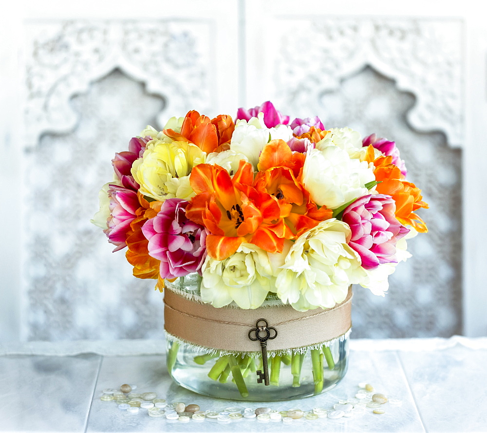 Bouquet of colourful flowers in a decorative container