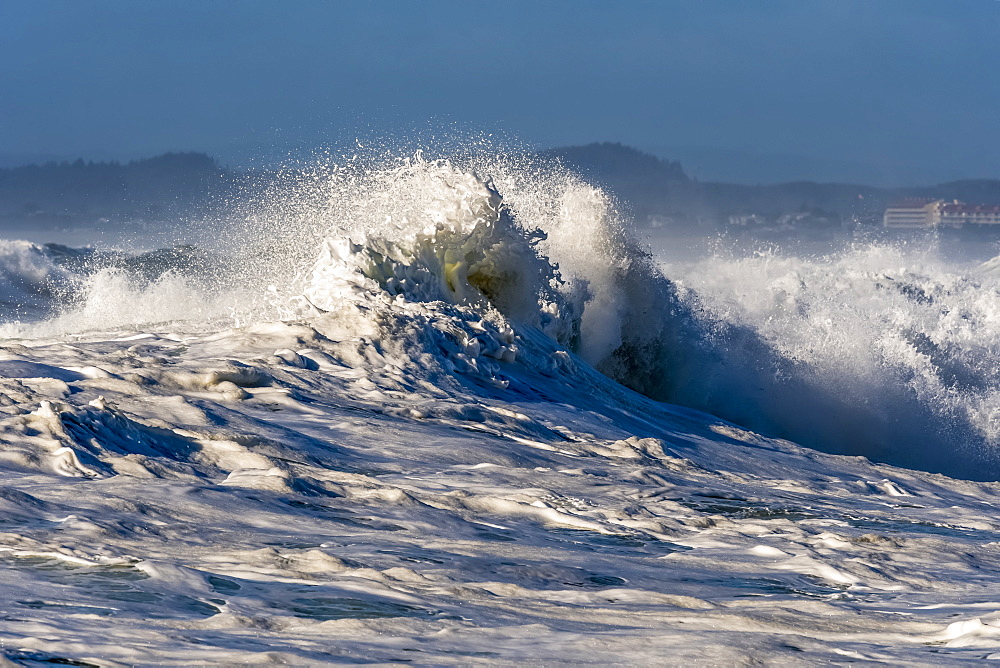 A wave breaks at Seaside Cove, Seaside, Oregon, United States of America