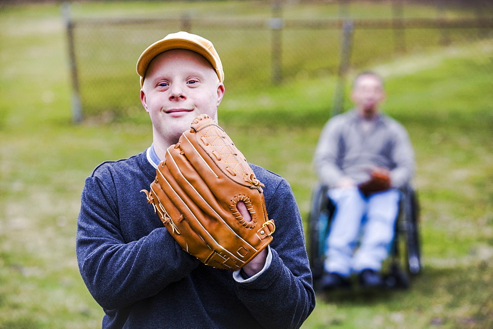 Man with Down Syndrome wearing a baseball glove