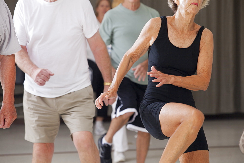 Senior people exercising in an exercising class