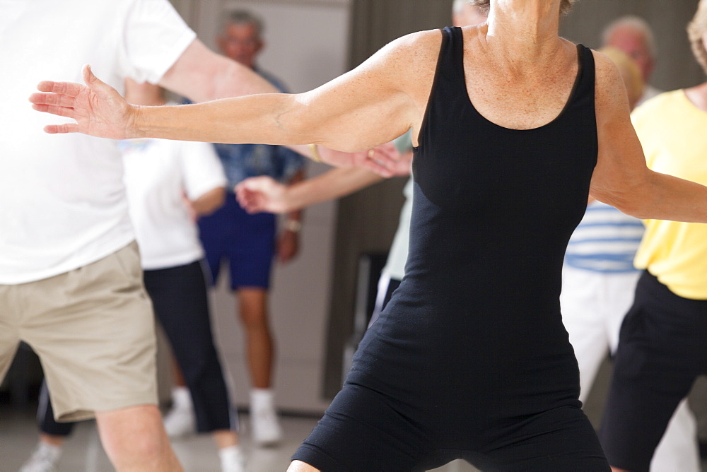 Senior people exercising in an exercising class