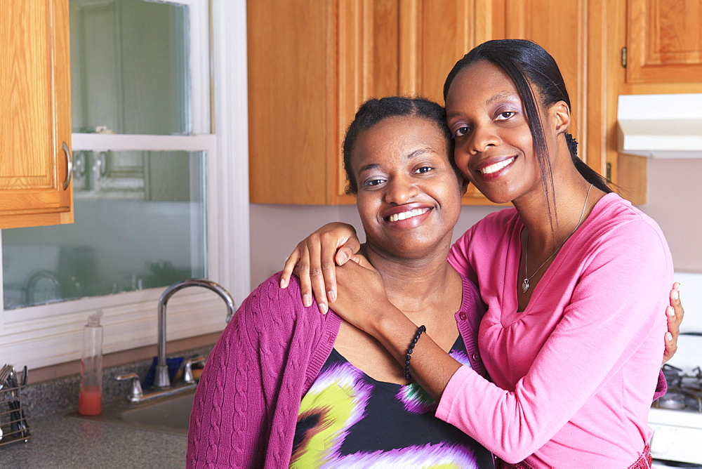 Portrait of two sisters smiling, one with learning disability