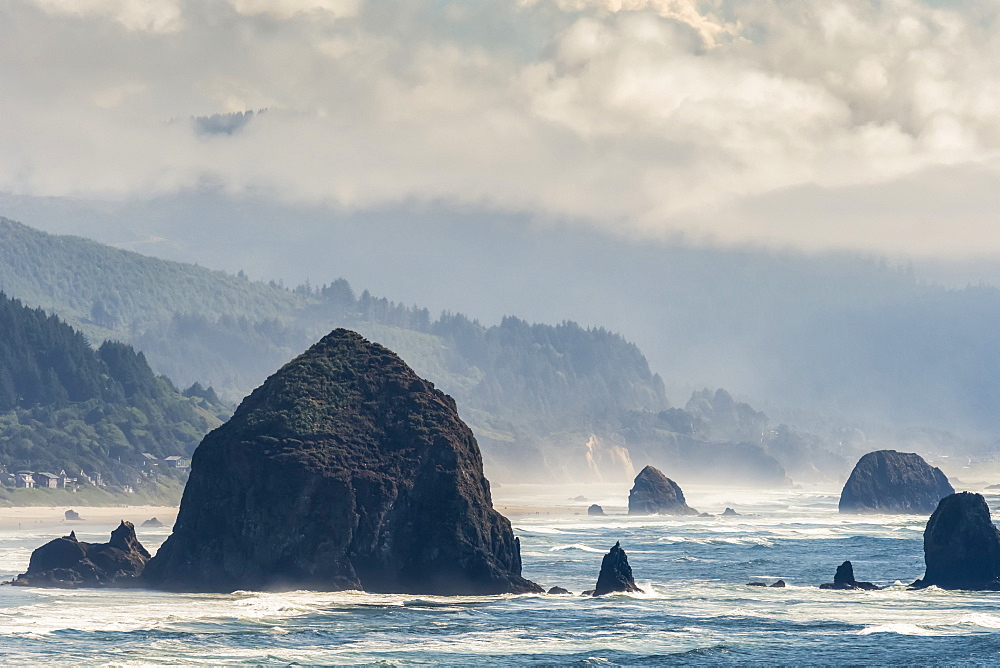 Haystack Rock is a prominent landmark at Cannon Beach on the Oregon Coast; Cannon Beach, Oregon, United States of America