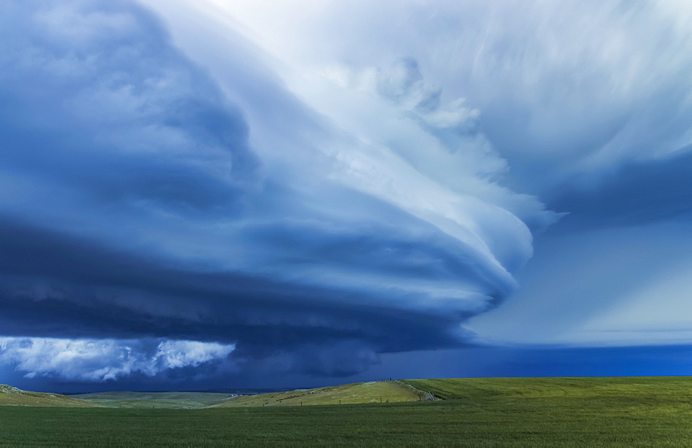 Dramatic dark storm clouds over farmland; Guymon, Oklahoma, United States of America