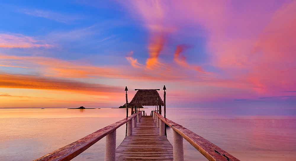 Pier off Malolo Island at sunrise into the South Pacific Ocean; Malolo Island, Fiji